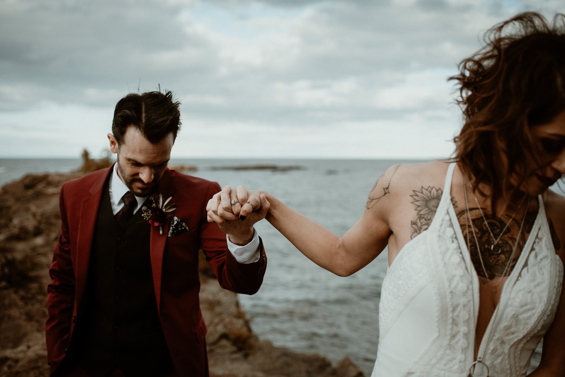 Bride and groom at the black rocks on Preque Isle in Marquette.