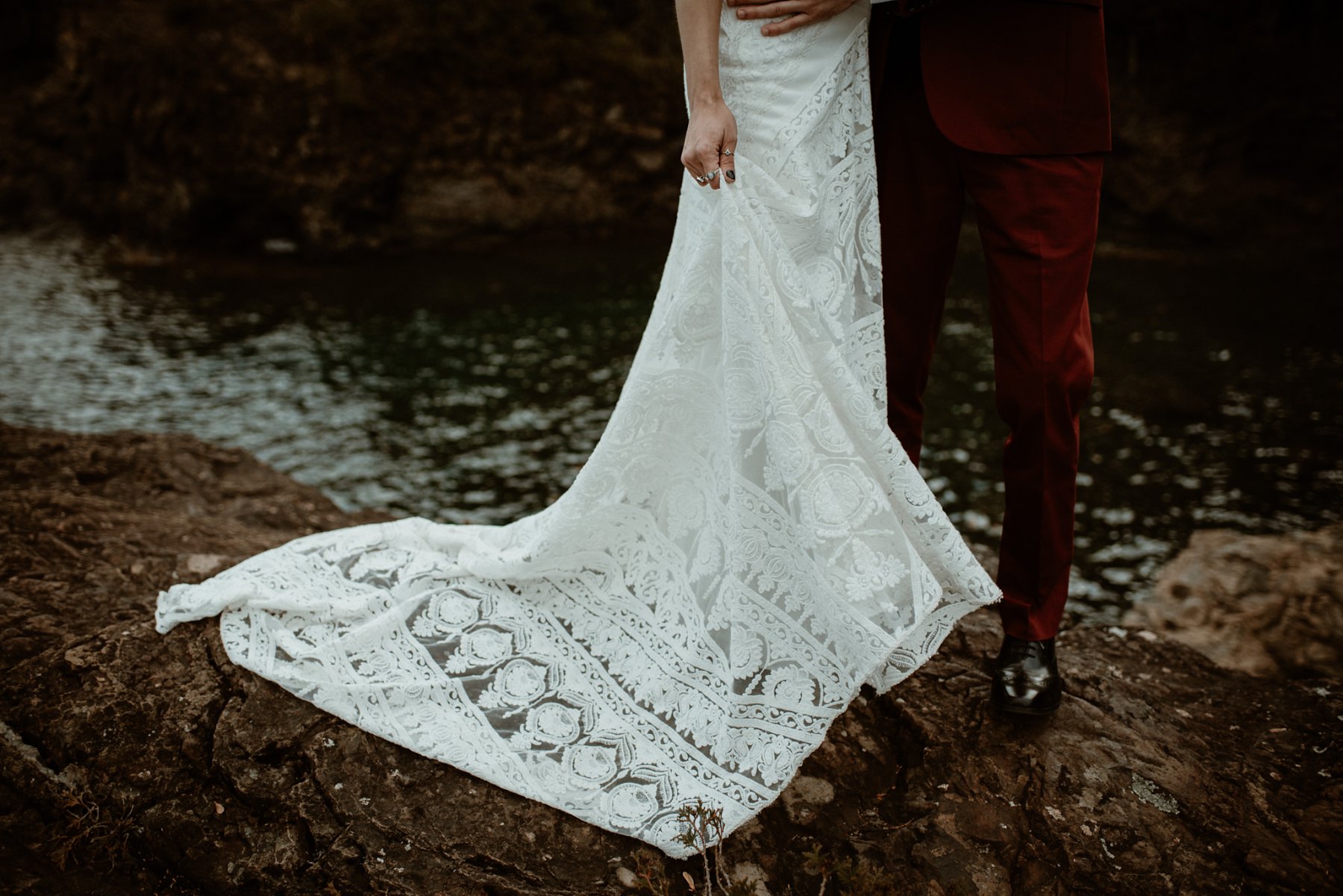 Bride and groom at the black rocks on Preque Isle in Marquette.