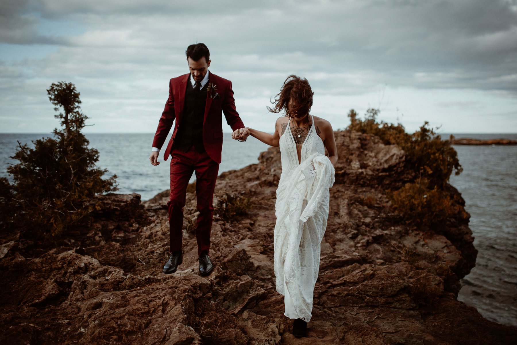 Bride and groom at the black rocks on Preque Isle in Marquette.