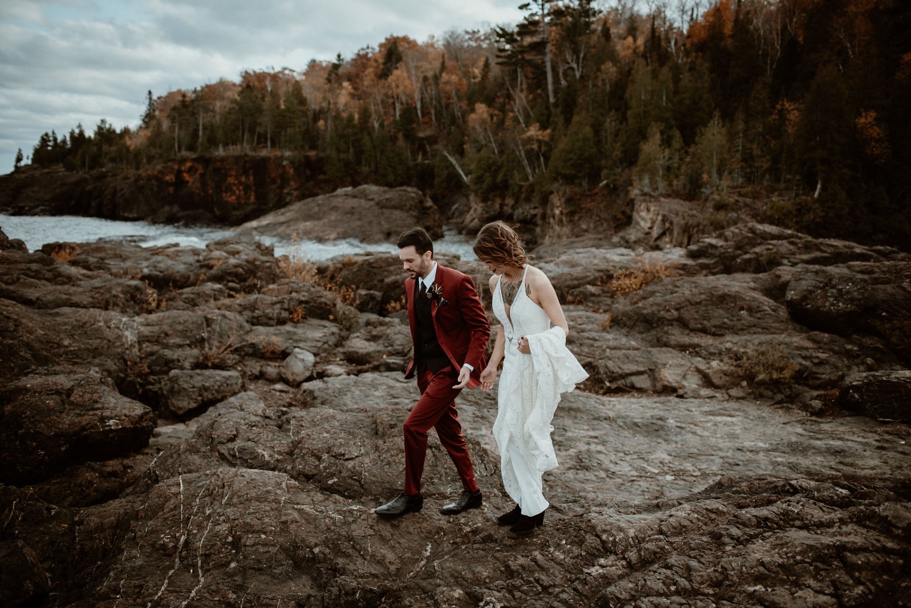 Bride and groom at the black rocks on Preque Isle in Marquette.