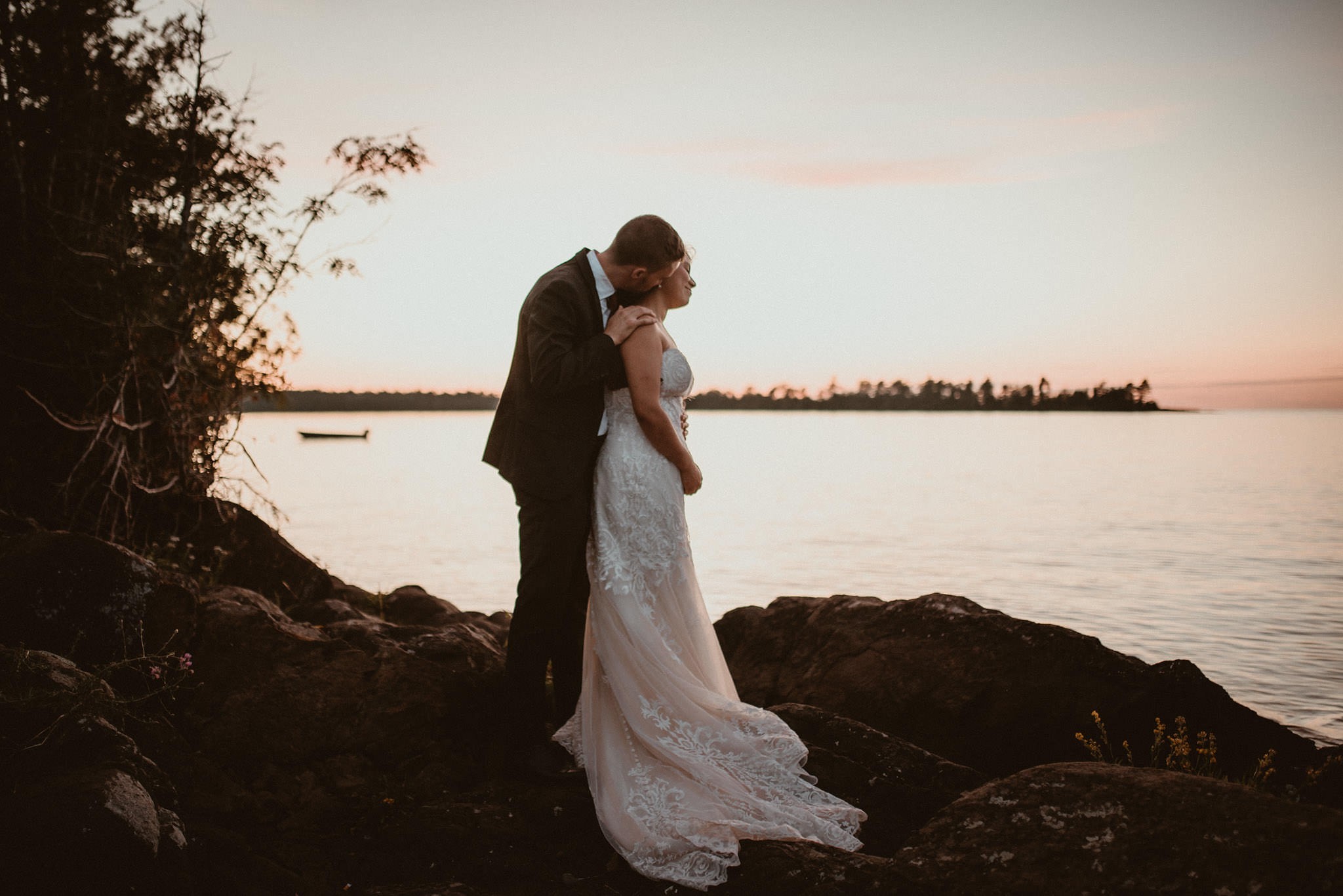 Bride and groom portraits on Lake Superior at sunset