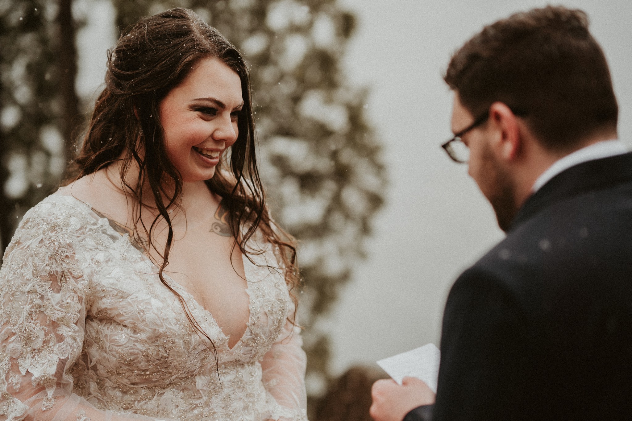 Groom reading his vows at their "just us" elopement in Michigan.