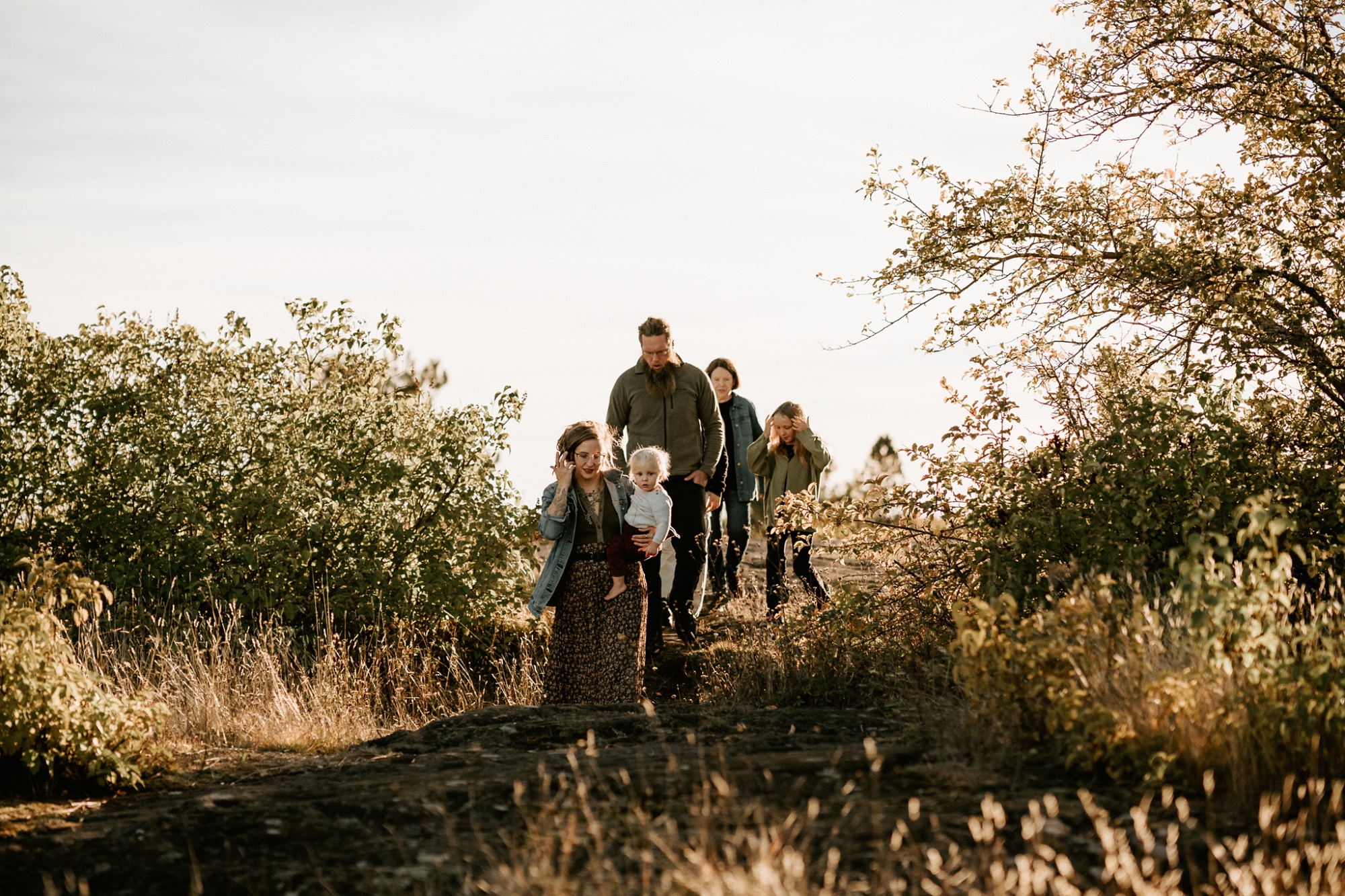 Family walking together in nature on the Keweenaw Peninsula.